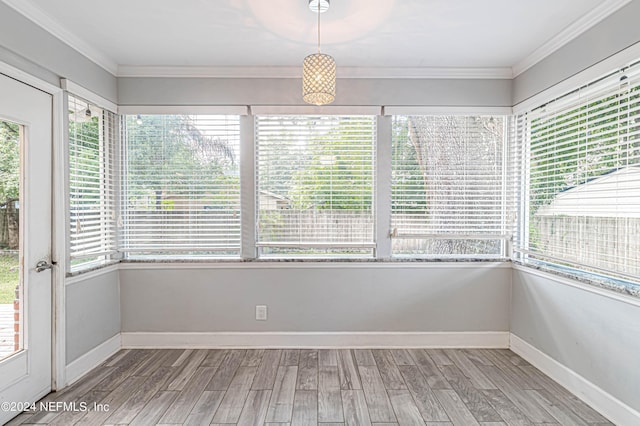 unfurnished sunroom with a wealth of natural light