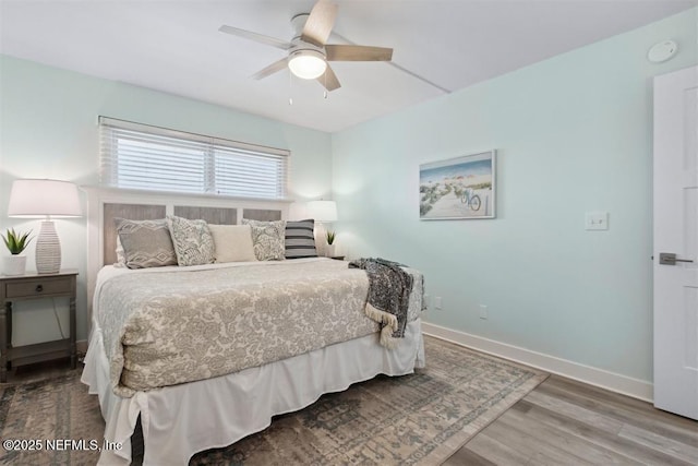 bedroom featuring ceiling fan and hardwood / wood-style floors