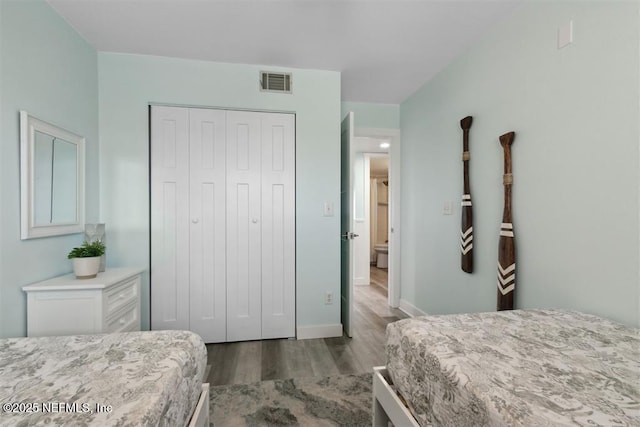 bedroom with a closet and light wood-type flooring