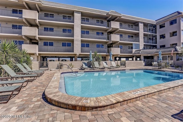 view of pool featuring a patio