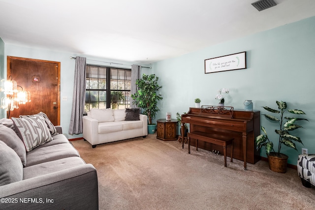 sitting room featuring light colored carpet