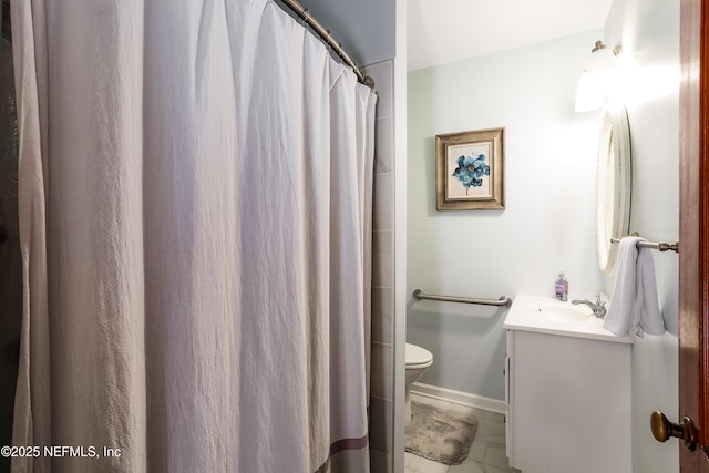 bathroom featuring vanity, toilet, and walk in shower