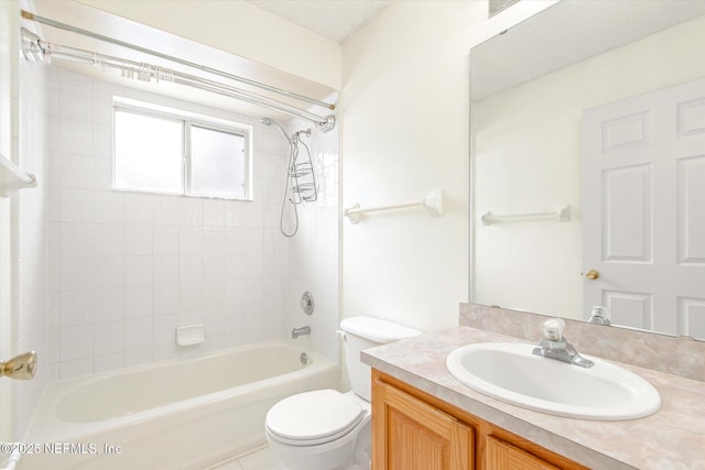 full bathroom featuring vanity, toilet, and tiled shower / bath combo