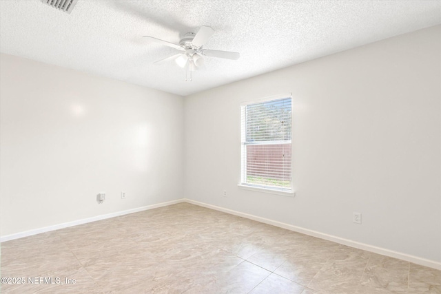 unfurnished room with light tile patterned floors, a textured ceiling, and ceiling fan