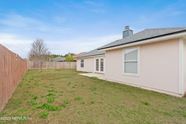 view of yard with french doors