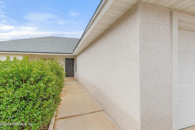 view of side of property with a garage