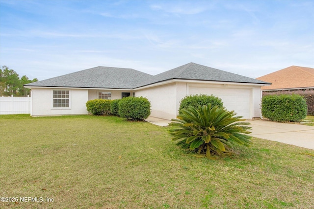 view of front of house with a garage and a front lawn