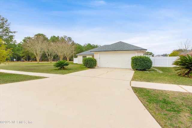 view of front facade with a garage and a front yard