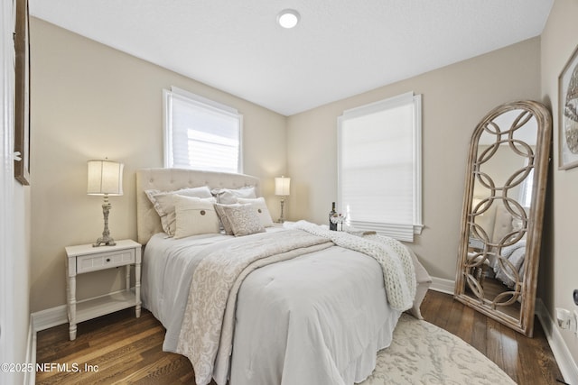 bedroom featuring dark hardwood / wood-style flooring