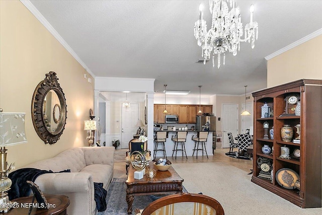 living room with ornamental molding, a chandelier, and a textured ceiling