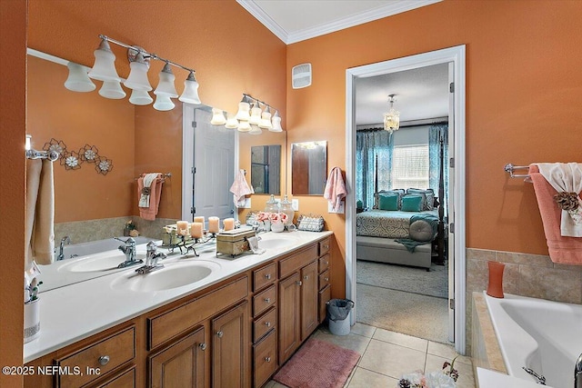 bathroom with crown molding, vanity, tile patterned flooring, and a bathtub