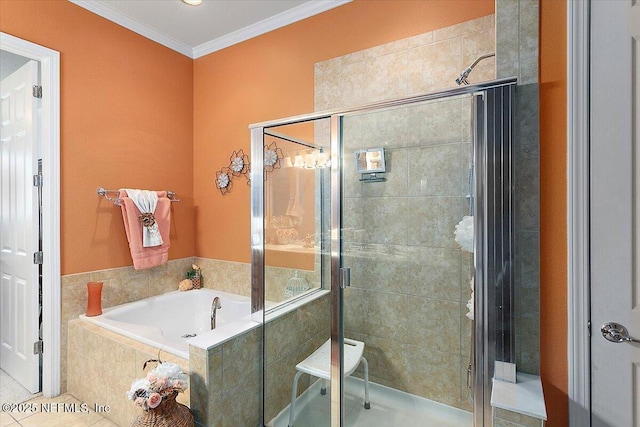 bathroom with ornamental molding and plus walk in shower