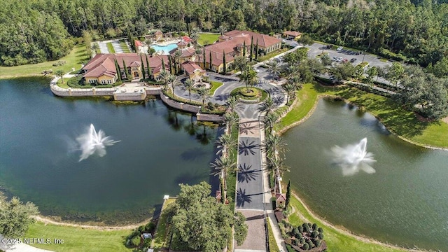 birds eye view of property with a water view