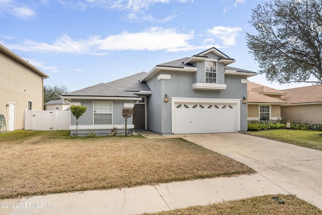 view of front of house with a garage and a front yard