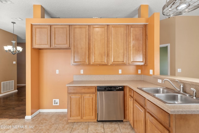 kitchen featuring sink, hanging light fixtures, a notable chandelier, stainless steel dishwasher, and kitchen peninsula