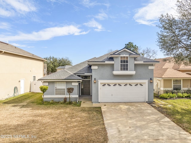 front of property featuring a garage and a front yard