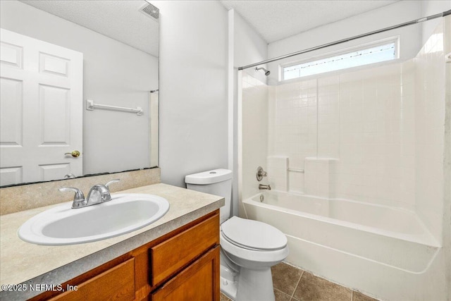 full bathroom with tile patterned flooring, vanity, a textured ceiling, bathtub / shower combination, and toilet