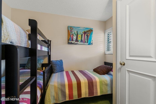 bedroom featuring a textured ceiling