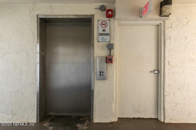 view of exterior entry featuring elevator