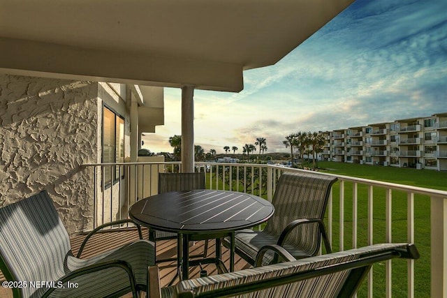 view of balcony at dusk