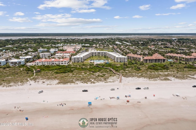 aerial view featuring a water view and a beach view