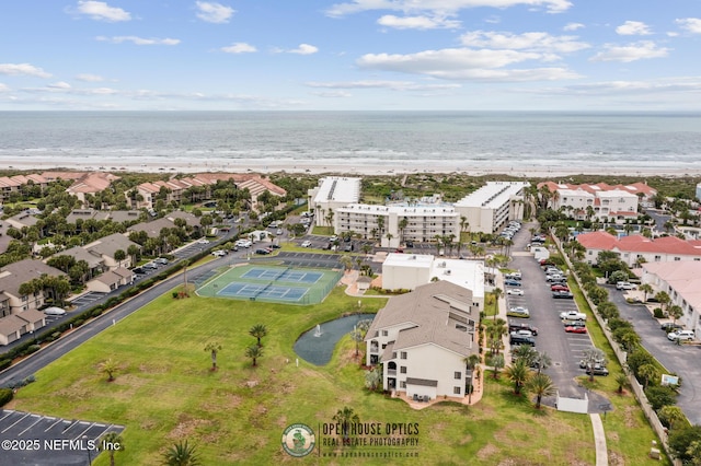 bird's eye view with a water view and a view of the beach