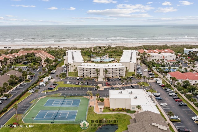 bird's eye view with a water view and a view of the beach