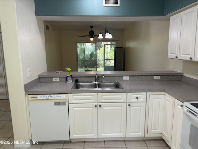 kitchen with white cabinetry, sink, light tile patterned flooring, and white appliances