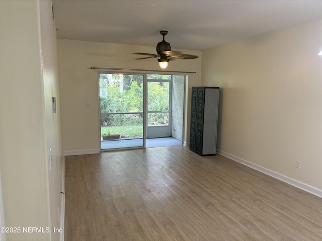 spare room featuring ceiling fan and light hardwood / wood-style flooring