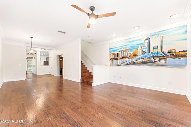 unfurnished living room with dark wood-style floors, stairs, visible vents, and crown molding