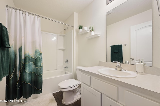 full bathroom featuring shower / tub combo with curtain, vanity, and toilet