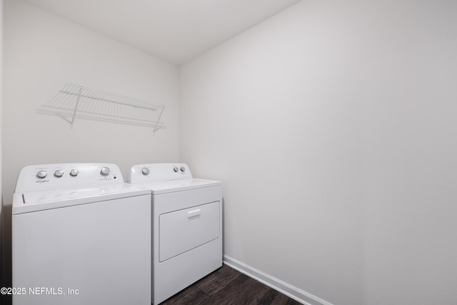 laundry area featuring washer and clothes dryer and dark hardwood / wood-style floors