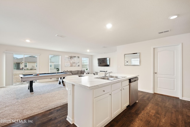 kitchen with sink, white cabinetry, a center island with sink, stainless steel dishwasher, and dark hardwood / wood-style floors