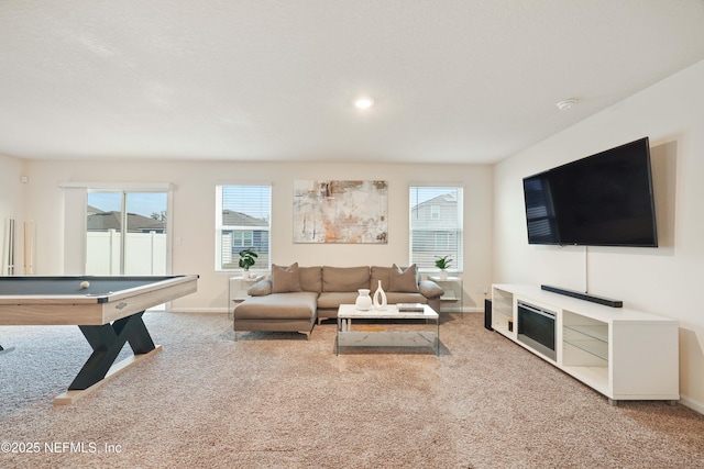 carpeted living room with pool table