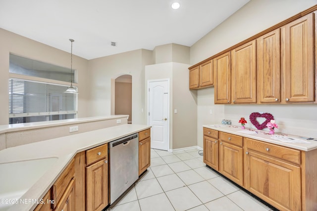 kitchen with arched walkways, decorative light fixtures, light countertops, light tile patterned flooring, and dishwasher