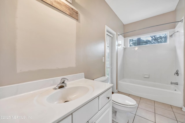 bathroom with toilet, vanity, shower / washtub combination, and tile patterned floors