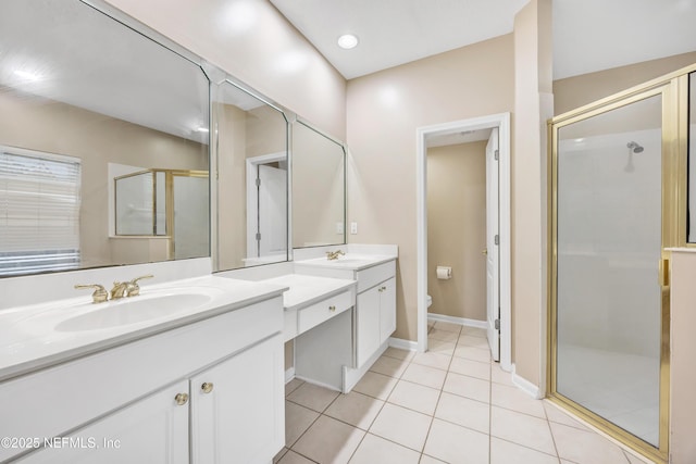 full bath with a stall shower, tile patterned flooring, vanity, and toilet