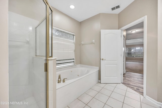 bathroom featuring recessed lighting, visible vents, a stall shower, a bath, and tile patterned floors