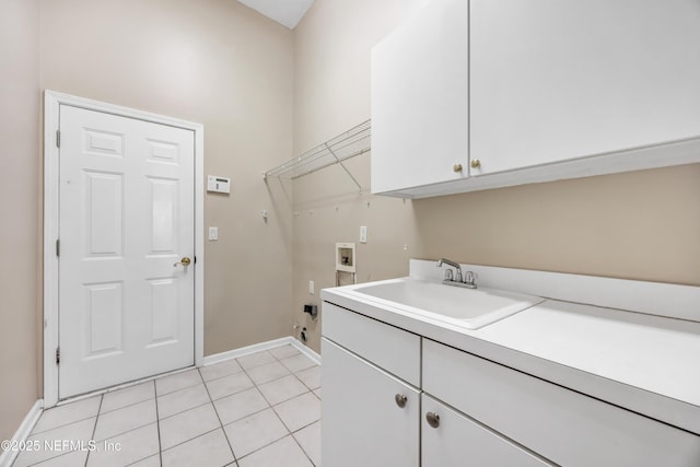 laundry room featuring light tile patterned floors, washer hookup, a sink, cabinet space, and electric dryer hookup