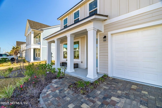 doorway to property featuring covered porch