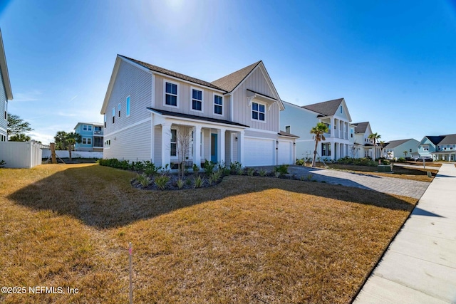 view of front of house with a garage and a front yard