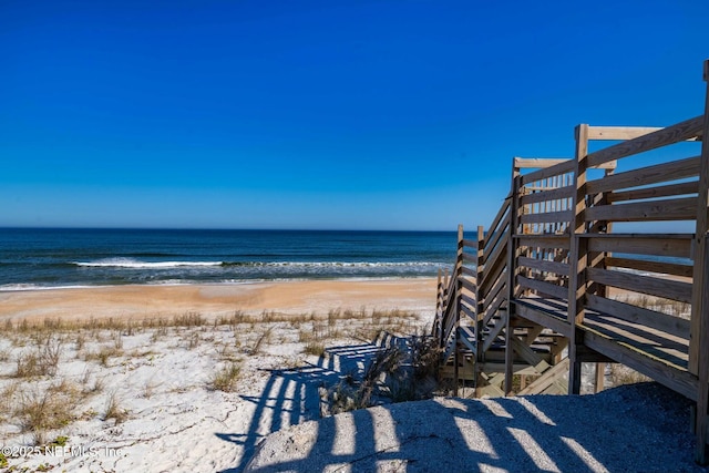 view of home's community featuring a view of the beach and a water view