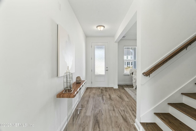 foyer with light hardwood / wood-style floors