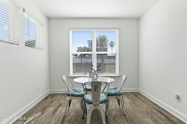 dining area with hardwood / wood-style flooring