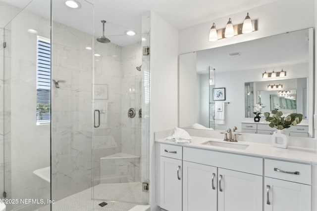 bathroom featuring vanity and walk in shower