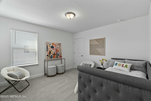 carpeted bedroom featuring a textured ceiling