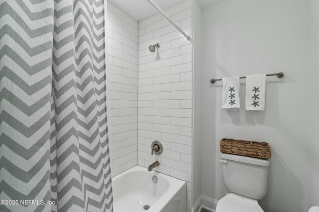 bathroom featuring tiled shower / bath and toilet