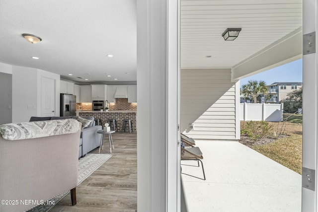 interior space featuring an outdoor living space and a patio area