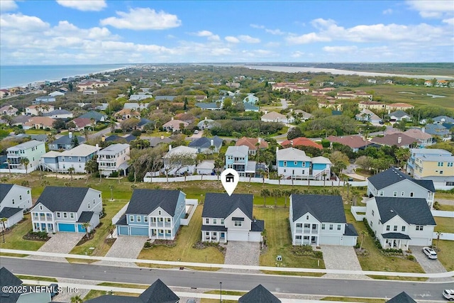 birds eye view of property featuring a water view and a residential view