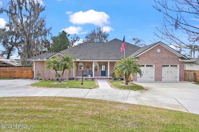 ranch-style home with a garage and a front yard